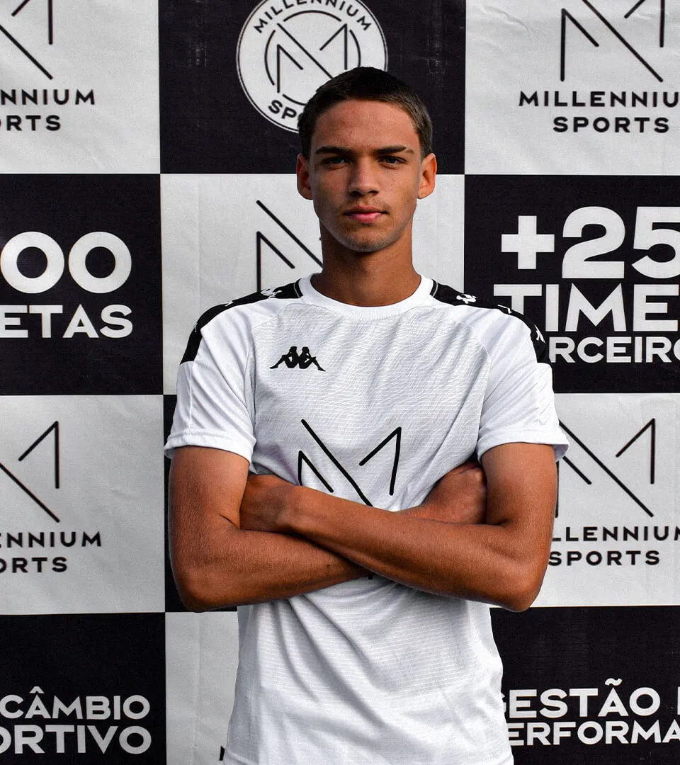 A soccer player with his arms crossed.